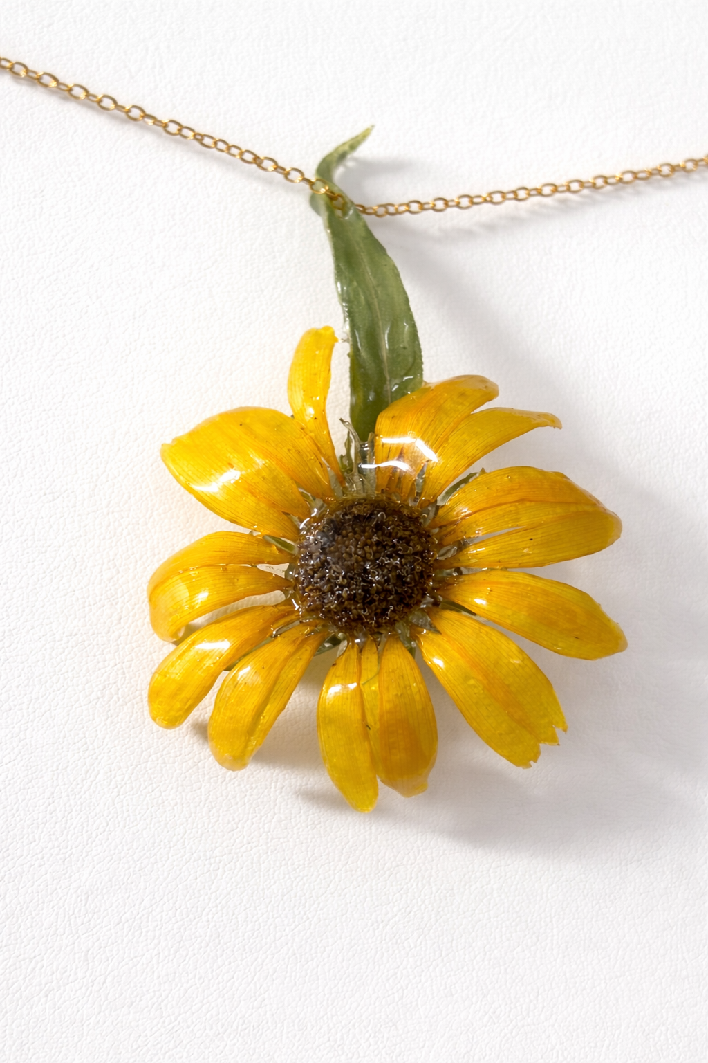 Sunflower pendant in clear resin