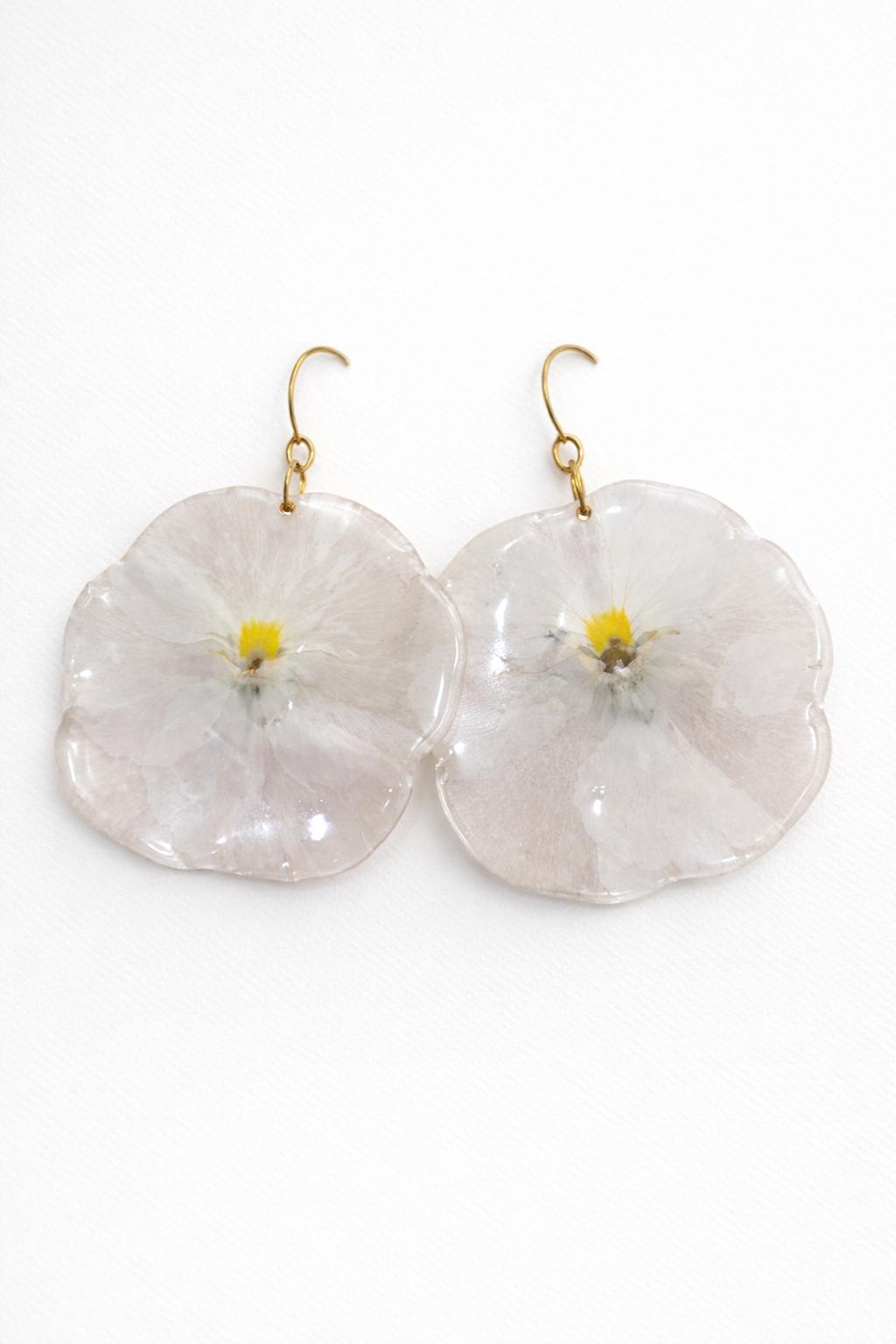 Real pressed ivory petunia preserved in resin.